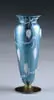 Vase by Durand, Blue glass background with white heart and vine decoration on gold circular foot, sold May 2004