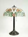 Duffner & Kimberly, Leaded Glass Table Lamp, Shade rests on a simple bronze colored base with three-light cluster