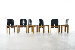 Afra & Tobia Scarpa, SET OF SIX '121' DINING CHAIRS FOR CASSINA, Solid walnut wood base with curved seat and backrest upholstered in black leather