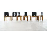 Afra & Tobia Scarpa, SET OF SIX '121' DINING CHAIRS FOR CASSINA, Solid walnut wood base with curved seat and backrest upholstered in black leather