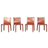 Mario Bellini, FOUR 'CAB 412' CHAIRS FOR CASSINA, Cognac saddle leather over a steel and plastic frame with a zipper system. Cassina sticker to plastic undersides