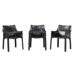 Mario Bellini, THREE 'CAB 413' ARMCHAIRS FOR CASSINA, Black saddle leather over a steel and plastic frame with a zipper system. Cassina etched to plastic undersides
