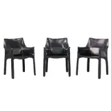 Mario Bellini, THREE 'CAB 413' ARMCHAIRS FOR CASSINA, Black saddle leather over a steel and plastic frame with a zipper system. Cassina etched to plastic undersides