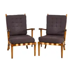 Schulim Krimper, PAIR OF ARMCHAIRS, Wooden frames with tan leather strapping supporting grey button back seat cushions