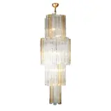 Toni Zuccheri, MONUMENTAL TRONCHI CHANDELIER FOR VENINI, Waterfall form of four tiers comprised of 64 handblown Murano glass cylinders. Clear and amber glass with textured surface