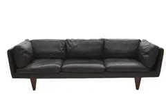 Illum Wikkelso, 'MODEL V11' SOFA FOR HOLGER CHRISTIANSEN, Quality black leather upholstery on solid rosewood feet