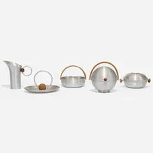 collection of five serving pieces by Russel Wright, c. 1935, spun aluminum, bamboo, birch, cork, sold Sep 2020
