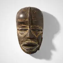 Dan, Deangle mask, carved and painted wood, woven fiber