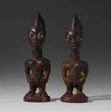 male Ere Ibeji (twin figures), pair by Yoruba, carved wood, sold Aug 2020