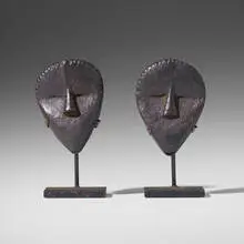Ma Go (passport) masks, pair by Dan, carved wood, sold Aug 2020