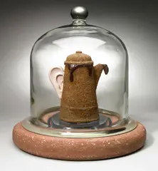Peter Zecher, Untitled (Vacuum Ground), enameled coffee pot, coffee grounds, glue, resin, glass, cement, and metal