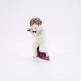 Putto mit Querflöte by Meissen, 19. Jh, Porzellan, farbig staffiert, gold dekoriert, sold May 2025