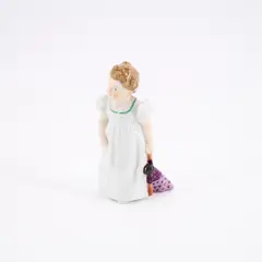 Mädchen mit Puppe by Meissen, Ausformung vor 1924, Porzellan, farbig dekoriert, sold May 2025