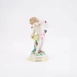 Großer Amor mit Korb by Meissen, Nach 1934, Porzellan, farbig staffiert, gold dekoriert, sold May 2025