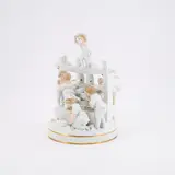 Große Gruppe 'Die Weinpresse' by Meissen, Vor 1924, Porzellan, vorwiegend weiß, nur die Inkarnate und Haare der Kinder staffiert. Goldrand, sold May 2025
