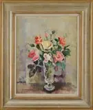 Nan Greacen, Roses in a Glass Vase, Oil on board table top still life scene shows a footed glass vase holding yellow, pink and red roses with green leaves