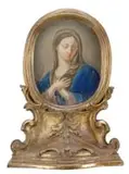 Unsigned, Madonna, Pastel type painting of a Madonna with crossed hands on chest has long flowing hair and blue robe