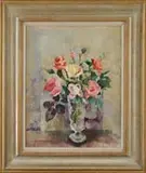 Nan Greacen, Roses in a Glass Vase, Oil on board table top still life scene shows a footed glass vase holding yellow, pink and red roses with green leaves