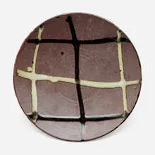 Shoji Hamada, Dish, c. 1955, dry iron-glazed stoneware with nuka and tenmoku glazes