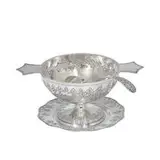 Colonial three-piece serving set with repoussé and chased grapevine decoration by Marshall Field & Co. Art Metal Craft, sold Apr 2022