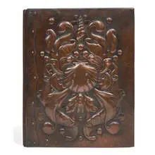 Newlyn Copper, English Arts & Crafts book cover with bold repoussé and applied decoration of an underwater scene, United Kingdom