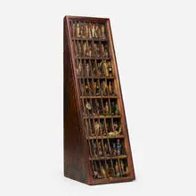 Small Wooden Figures in Printer's Tray by Barry Cohen, c. 1985, wood and mixed media, sold Apr 2020
