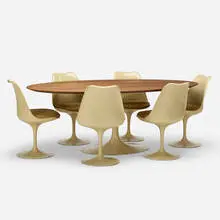 dining set by Eero Saarinen, 1956, enameled steel, laminate over lacquered wood, enameled aluminum, molded fiberglass, upholstery, sold Feb 2020