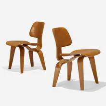 early DCWs, pair by Charles and Ray Eames, 1945 / 1947, walnut plywood, rubber, sold Feb 2020