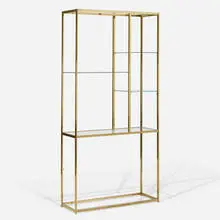 shelving unit by Milo Baughman, c. 1975, brass-plated steel, glass, sold Feb 2020
