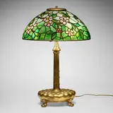 Apple Blossom table lamp by Tiffany Studios, c. 1910, leaded glass, gilt bronze, sold Jul 2024