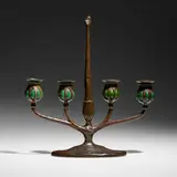 Four-arm candelabrum with snuffer by Tiffany Studios, c. 1910, patinated bronze, hand-blown glass, sold Jul 2024