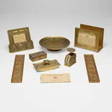 Tiffany Studios, Abalone eight-piece desk set, c. 1915, gilt bronze, printed card stock, mother-of-pearl