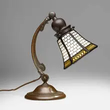 Teroca geometric overlay desk lamp by Handel, c. 1910, patinated metal, slag glass, sold Jul 2024