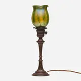 Damascene candle lamp by Tiffany Studios, c. 1910, hand-blown Favrile glass, patinated bronze, sold Jul 2024