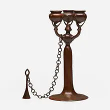 Candelabrum with snuffer by Tiffany Studios, c. 1910, patinated bronze, sold Jul 2024