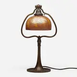 Damascene desk lamp by Tiffany Studios, c. 1910, acid-etched and patinated bronze, hand-blown Favrile glass, sold Jul 2024