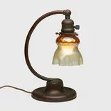 Desk lamp by Tiffany Studios, c. 1910, patinated bronze, hand-blown Favrile glass, sold Jul 2024