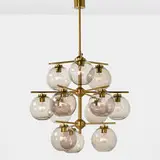 Holger Johansson, chandelier and two sconces, 1952, matte and polished brass, blown glass