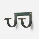 Jacques Adnet, Wall hook, c. 1965, saddle-stitched leather over steel