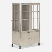 Cabinet by Dexon Manufacturing Inc., c. 1975, stainless steel, acrylic, casters, sold Jun 2024