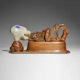 Paul Noble, Twenty-two, 2004, glazed ceramic, walnut