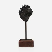 Face by Lamar Briggs, patinated bronze, wood, sold Jun 2024
