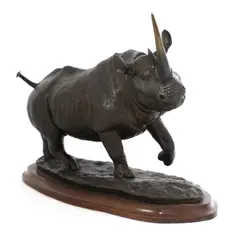 Untitled by Terry Owen Matthews, Terry Owen Matthews (b.1931) A bronze rhino, on a wood plinth signed and dated 1987, sold Jun 2021