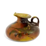 Grace Young for Rookwood Pottery, earthenware Standard Glaze creamer with leaf and berry decoration