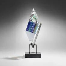 Untitled by Toland Sand, 2001, ground, polished, and laminated optical crystal, stainless steel, granite, sold May 2024