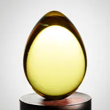 Golden Egg II by Christopher Ries, 1987, cut, ground, and polished Cerium-colored optical crystal, sold May 2024