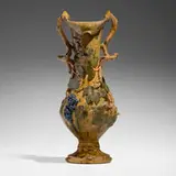 Tall vase with grapevines by George E. Ohr, 1899, glazed earthenware, sold Apr 2024