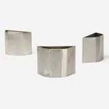 Frank Lloyd Wright, wastepaper baskets from Price Tower, Bartlesville, Oklahoma, set of three, 1956, stainless steel