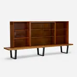 slat bench with bookcases by George Nelson & Associates, 1946, birch, walnut, lacquered wood, glass, aluminum, sold Apr 2019