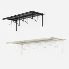 coat racks, set of two by Mathieu Matégot, c. 1956, perforated and enameled steel, brass, enameled brass, sold Apr 2019